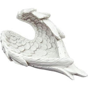 White ceramic sculpture of a fish on a white background