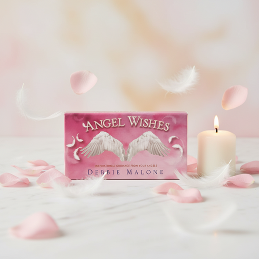 Pink book titled 'Angel Wishes' by Debbie Malone with a candle and rose petals on a soft background