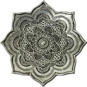 Decorative metal incense burner with intricate mandala design on a white background