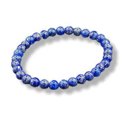 Blue beaded bracelet on a white background
