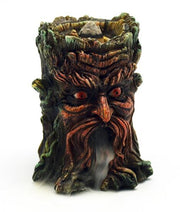 Tree-like sculpture with facial features and smoke emission on a white background