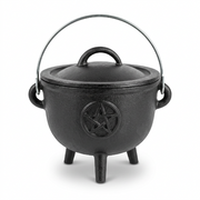 A black cast iron cauldron-shaped pot with a lid, triple feet, side handles, and a metal top handle, featuring an embossed pentagram symbol on the front, shown on a white background.