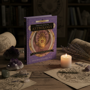 Book titled 'Complete Book of Astrology' on a wooden table with candles, crystals, and herbs in an astrology-themed setting.