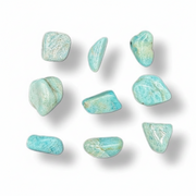 Nine small polished tumbled stones in a light aqua turquoise color with natural white veining, arranged on a white background with soft drop shadows.