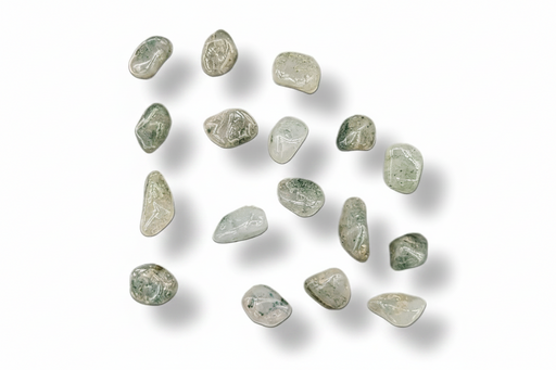 A group of small, polished tumbled gemstones in pale green, gray, and white tones, arranged on a clean white background with soft drop shadows.