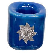 Blue ceramic holder with silver sun design on a white background