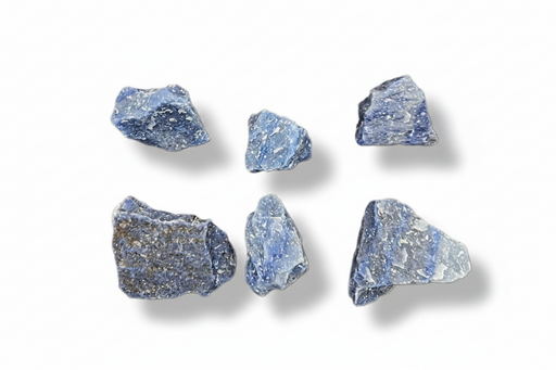 Six rough blue-gray minerals  arranged in two rows on a plain white background, each casting a soft shadow.