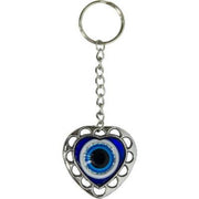 Heart-shaped keychain with an evil eye design on a white background