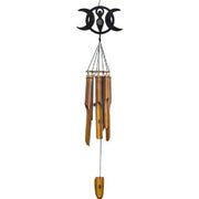 Wooden wind chime with triple moon symbol on a white background