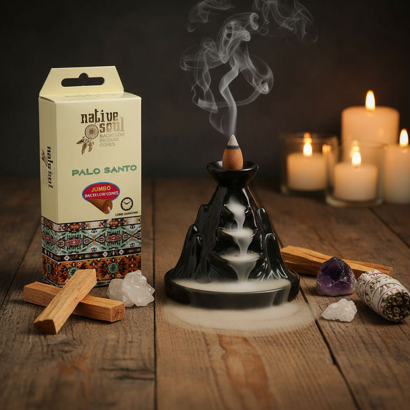 Incense burner with smoke, Native Soul Palo Santo packaging, candles, and crystals on a wooden surface.