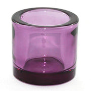 Purple glass candle holder on a white background
