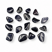 A set of polished blue goldstone tumbled, arranged on a clean white background.