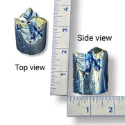 Mineral sample with top and side views shown next to a ruler for scale.
