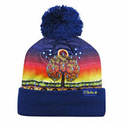 Colorful beanie with a tree design and blue pom-pom on a white background