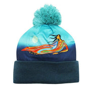 Blue beanie with colorful design of a woman and dolphin on a white background