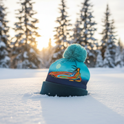 Colorful beanie with a design on a snowy landscape