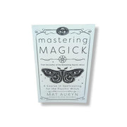 Book titled 'Mastering Magick' by Mat Auryn on a white background