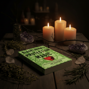 Book titled 'Protection Magic' with candles and crystals on a dark background