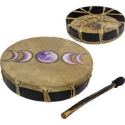 Two drums with painted designs and a drumstick on a white background