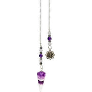 Pendulum with a purple crystal pendant on a white background