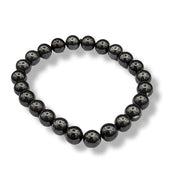 Black beaded bracelet on a white background