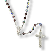 Glass Birthstone Rosary for February on a white background