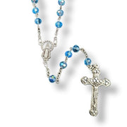 Glass Birthstone Rosary for March on a white background