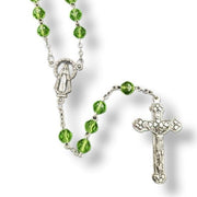 Glass Birthstone Rosary  for August on a white background