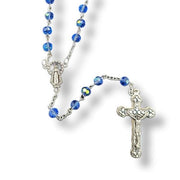 Glass Birthstone Rosary for December on a white background