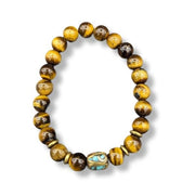 Beaded bracelet with yellow and brown beads on a white background