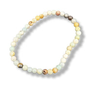 Beaded bracelet with multicolored beads on a white background