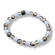 Beaded bracelet with blue, gray, and silver beads on a white background