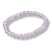 Purple beaded bracelet on a white background