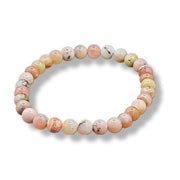Beaded bracelet with multicolored beads on a white background
