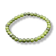 Green beaded bracelet on a white background