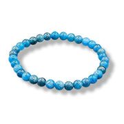 Blue beaded bracelet on a white background