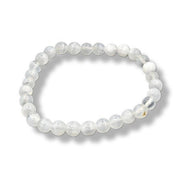 White beaded bracelet on a white background
