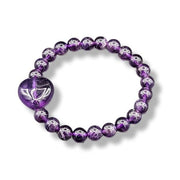 Purple beaded bracelet with a heart-shaped clasp on a white background
