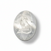 Selenite palm stone  with engraved wolf design on a white background