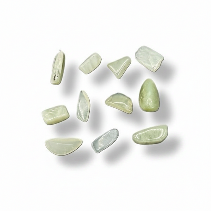 Green stones on a white surface 