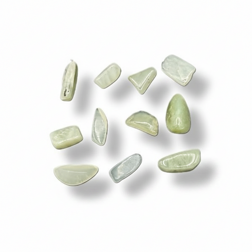 Green stones on a white surface 