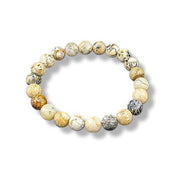 A bracelet made of Dendritic Opal beads in various shades of white, beige, and brown, with natural variations in color and pattern.