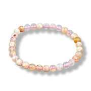 Multicolored beaded bracelet on a white background
