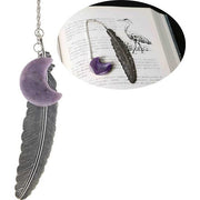 Bookmark with purple crescent moon and feather pendant on a white background