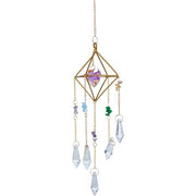 Decorative hanging crystal with geometric design on a white background