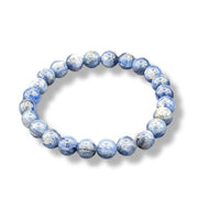 Blue marbled bracelet with white pattern on a white background