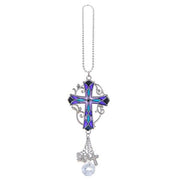 Decorative cross car charm on a white background