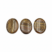Tiger's Eye worry stones on a white background