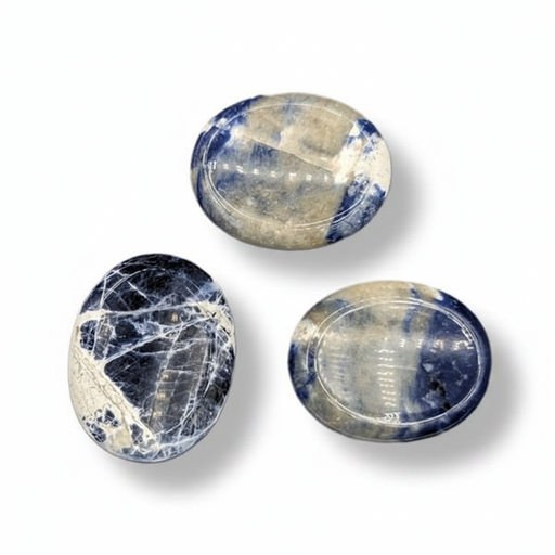 Sodalite worry stones on a white background