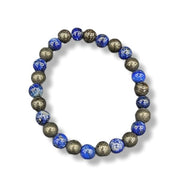 Bracelet with blue and gold beads on a white background
